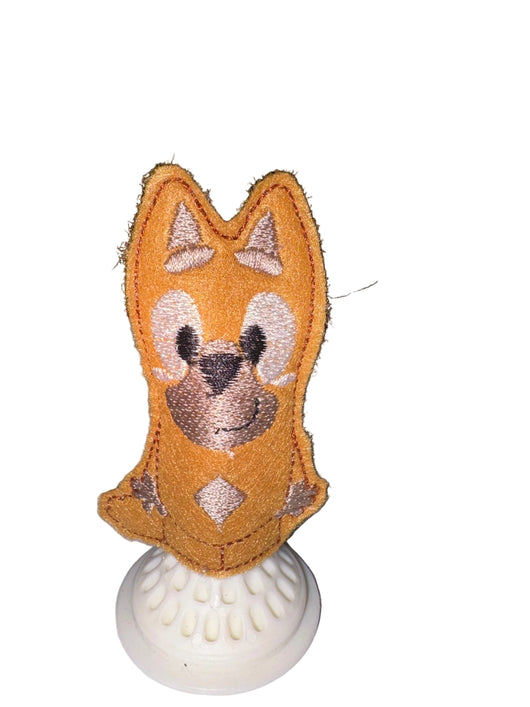 Rusty dog finger puppet